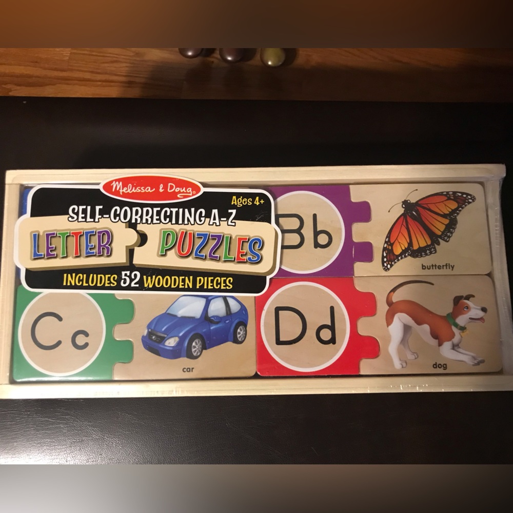 NWT Melissa & Doug self-correcting kids A-Z letter puzzles w/ 52 wooden pieces.